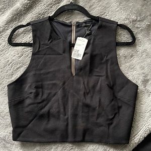 Black sleeveless crop top.